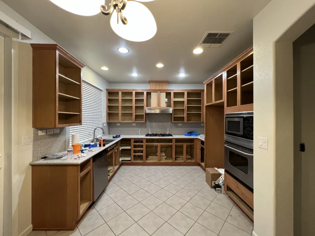 a before picture of a kitchen prior to a white finish