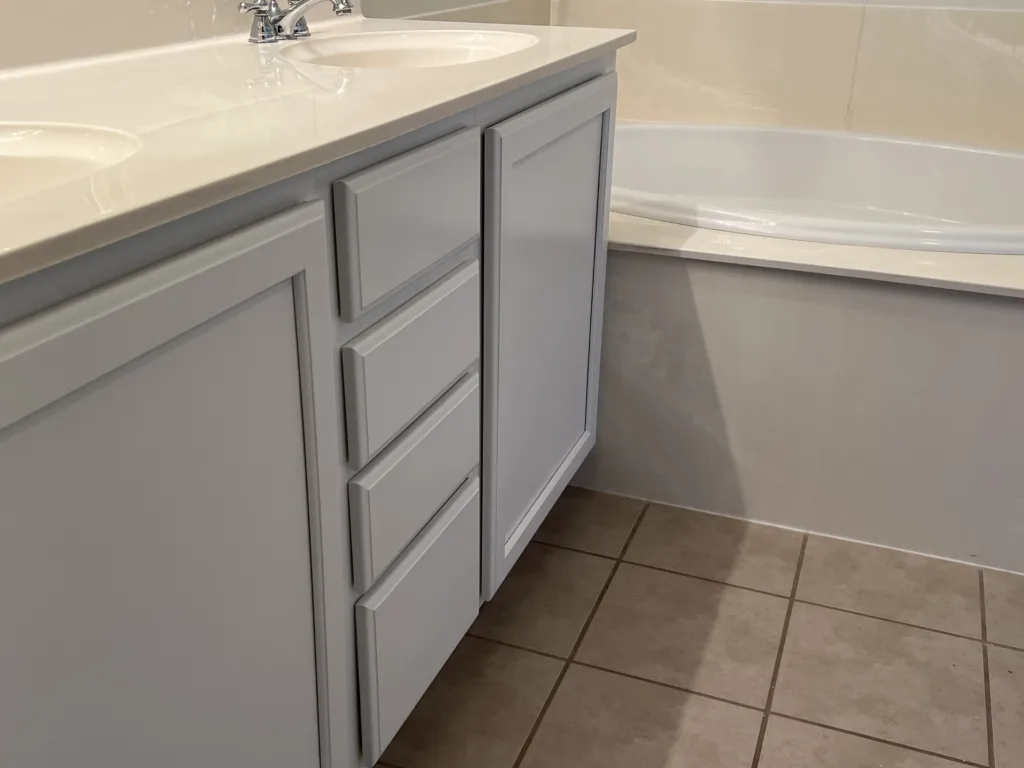 white painted cabinet vanity in master bath