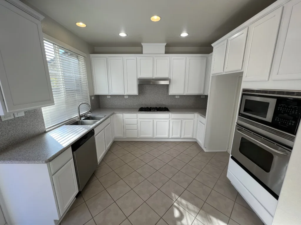 freshly white painted kitchen cabinets