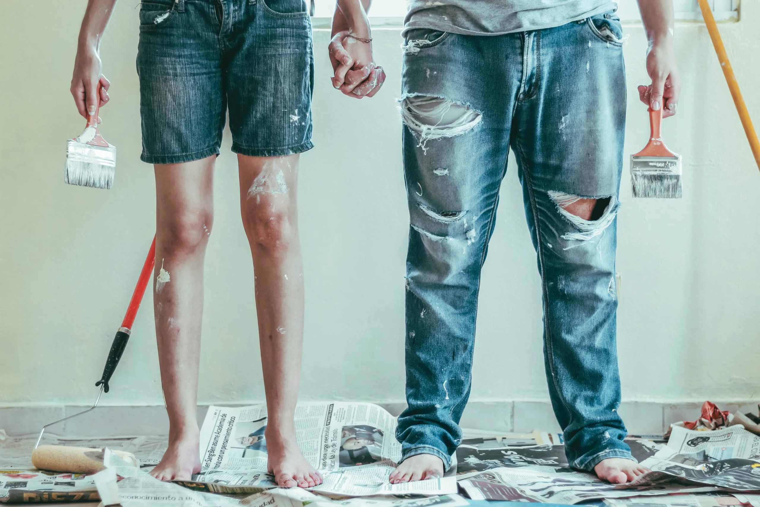 two couples trying their best to paint chipped and bubbled paint