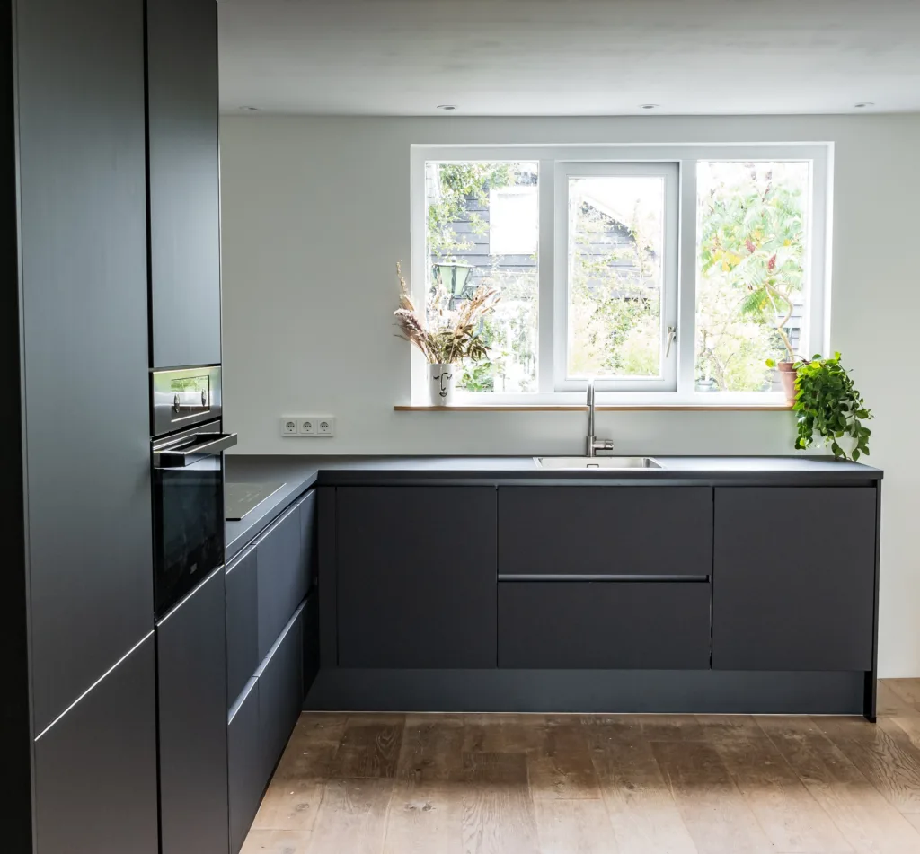 a gray-ish black painted kitchen cabinet