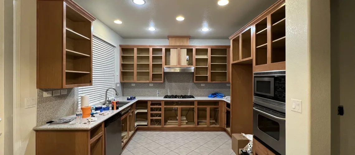 a before picture of a kitchen prior to a white finish