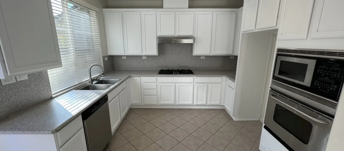 freshly white painted kitchen cabinets