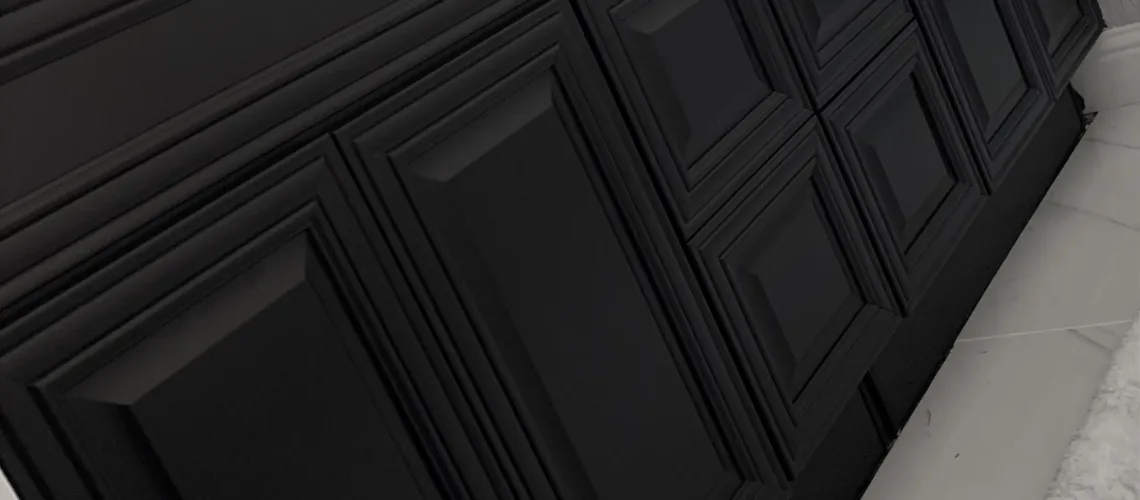 "An image showing black painted cabinets in a room, featuring sleek and modern design with a smooth and glossy finish."