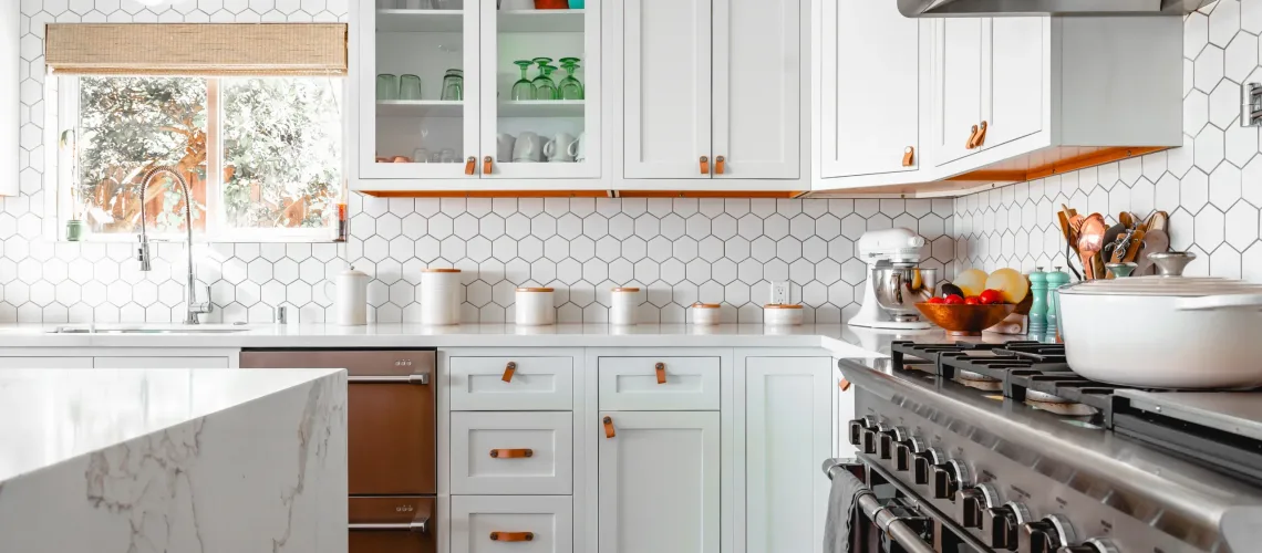 white cabinets with gold handles in the kitchen